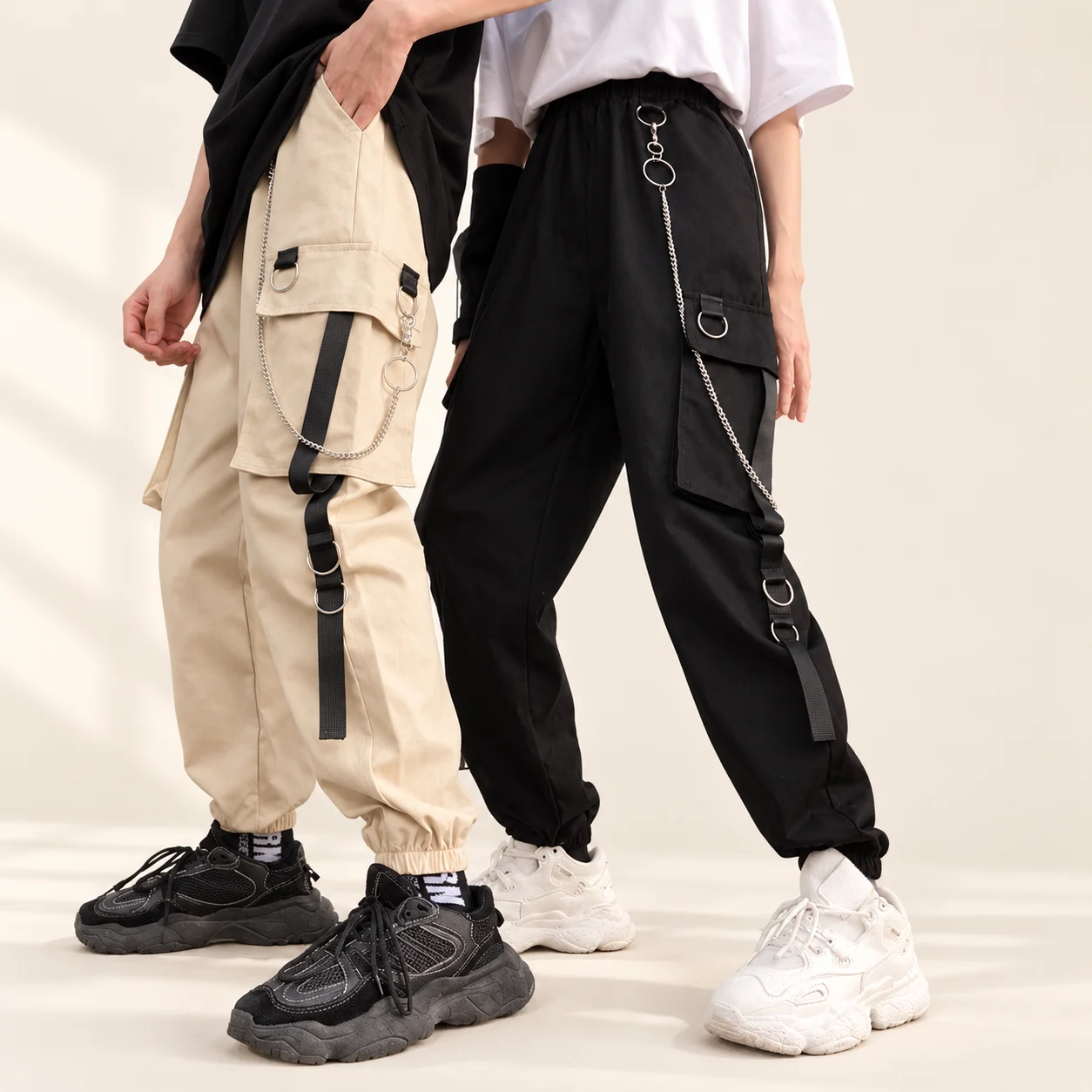 Aesthetic Pants With Chain in beige and black, showing cargo pockets, hanging straps and silver chains
