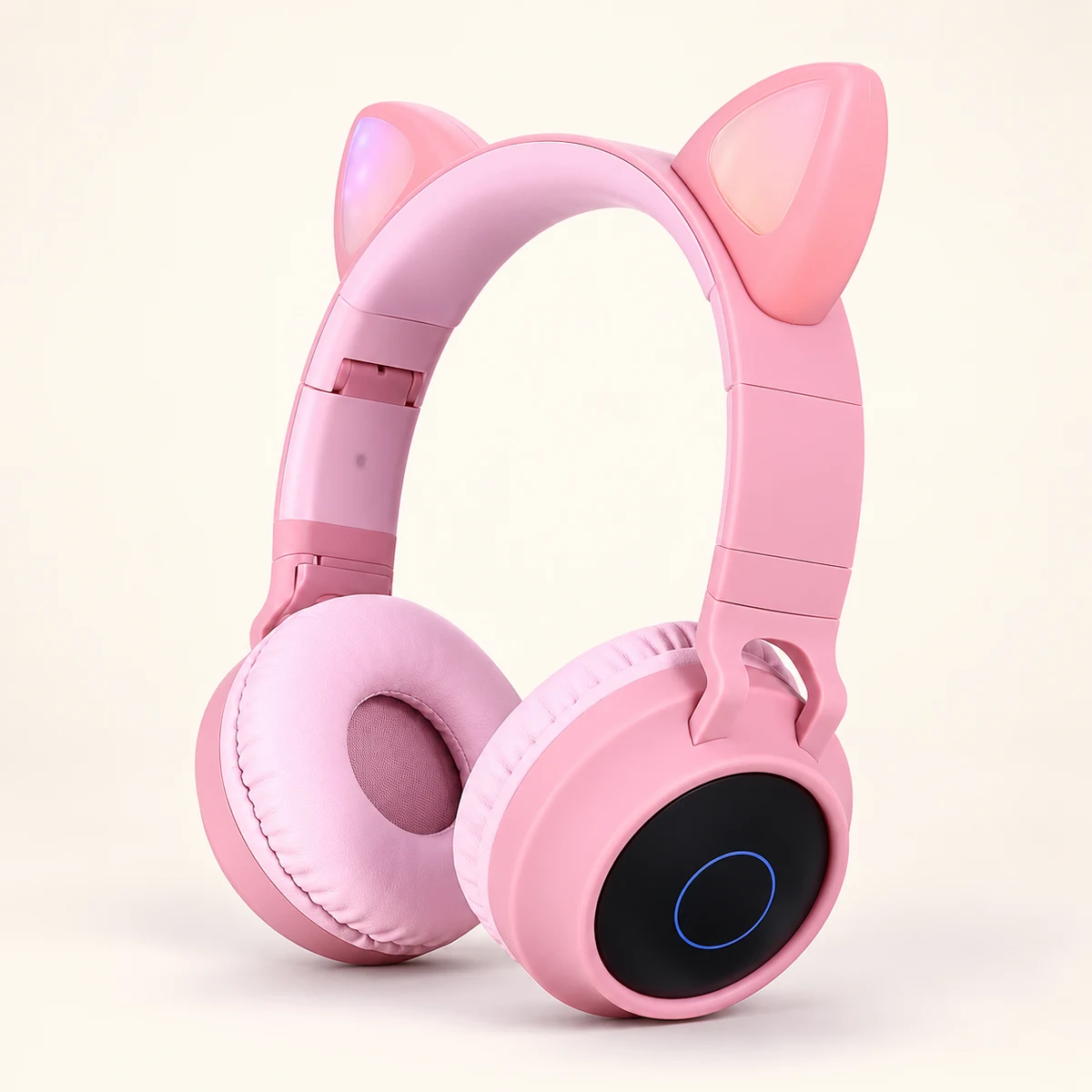 Pink wireless cat-ear headphones with padded ear cups and a black circular ear panel